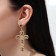 Hanging earrings with rhinestones "crosses", white-Benzine color in gold