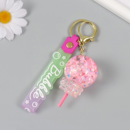 A keychain plastic with a carbine, a strap "Lollipop with a bow" Water with a glitter of 4x4x6.5 cm-2