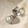 Clips "Grace" Rounding with bead, white color in black silver