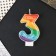 A candle for a cake, a number with color application of 3 "Happy Birthday".
