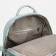 A backpack with a zipper, 4 outer pockets, green color