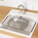 A colander - a sieve on a sliding sink, 34.5 × 24 × 7.5 cm, sliding, stainless steel