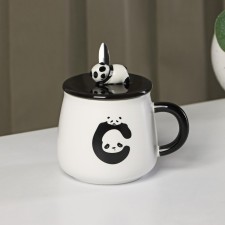 Ceramic mug with a lid and spoon 