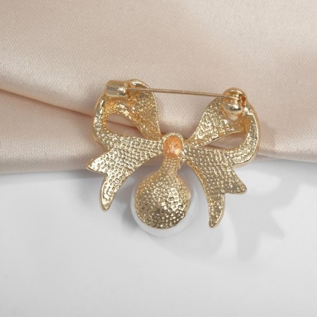 Brooch "Pearl" classic bow, white color in gold-1