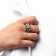 Ring Metal "Tren" is crumpled, the color is silver, dimensionless