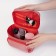 A cosmetic bag with a zipper, with a mirror, the color is red
