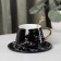 Tea couple ceramic with a gold spoon, 2 items: a cup 240 ml, a saucer d = 14.8 cm, black color is black