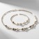 Set 2 objects “necklaces, bracelet” noel figure, white color in gold