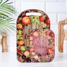 Set of wooden cutting board and a hot stand with decor 
