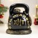 The piggy bank "Snake with weights" is black, 25 cm
