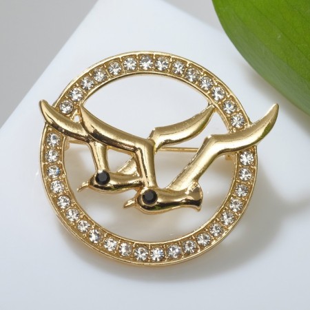 Brooch "Birds" in a circle, white color in gold