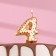 Candle in the Sanata cake, number "4", gold with red stars, 5.5 cm