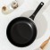The “Tradition” pan, d = 24 cm, plastic handle, glass cover, anti -stick coating, black color