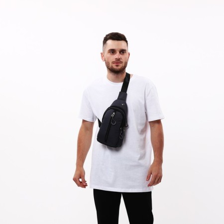 Male sling bag from textiles, headphone opening, gray color