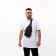 Male sling bag from textiles, headphone opening, gray color