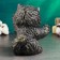The piggy bank "joyful cat" is black, gold, 20cm