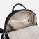 A backpack with a zipper, 4 outer pockets, black color