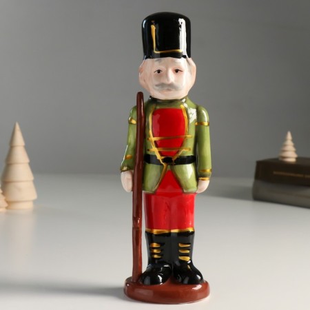 Souvenir Ceramics "A mustachioed Nutcracker in a green-red camisole with a gun" 25x8x6.5 cm