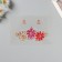 Sticker of rhinestones plastic on the face "Three flowers" pink shades 14.5x16 cm