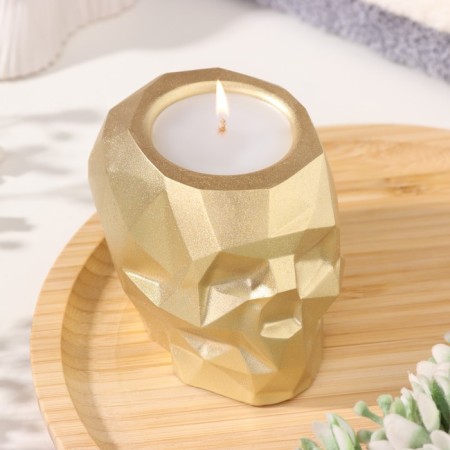 Candle "Skull" in a candlestick of gypsum with faces, 6x9x6.5cm, gold