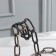 Stand for the bottle of the share "chain", 18.5 × 13 × 19 cm, brown color