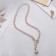The necklace is “pearl” with a flipping element, dragonfly, pink color in gold, 50 cm