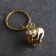 Souvenir-codes "Frog with a ball", brass, amber