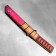 The souvenir is wooden "Tanto knife", in the scabbard, pink