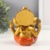 Souvenir Polystone for bronze "Ganesha, in orange haremasses" 10x10x12.5 cm