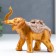 Polystone souvenir "African elephant with a flower on a blanket" under a bronze of 12.5x7x14 cm