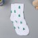 A gift of socks in a bank with a print "Everything in a Christmas tree" (male)