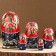 Matryoshka "couple", red scarf, 5 puppet, suite