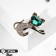 Brooch "Kit" with a bow, the color is emerald white in gold