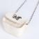 Female bag on a magnet, white color