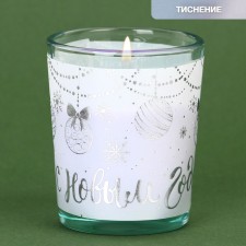 New Year's candle in a glass 