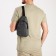 Male sling bag from textiles, headphone opening, gray color
