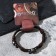 Bracelet Skin Skull is large, with bones, dark brown color with black silver, 8 cm