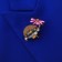 Brooch "Hedgehog with Flower", colored in gold