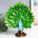 Polystone souvenir "Blue peacock with green, blossoming tail in the meadow" 13x30x35 cm
