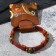 Bracelet Skin "Skull" is small, with bones, the color is light brown with black gold, 8 cm