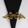 Cardigan clamp "Bant", the color of gold in black gold