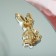 Broach "Bunny" Flower tail, white-pink color in gold