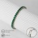 Bracelet with rhinestones "shine" on a puff, emerald color in gold