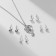 Set of 5 objects: 4 pairs fluffs, the pendant "dolphin", white color in silver, 45 cm