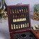 Wine set: a soda knife with a corkscrew, a drip, a foil knife and a plug for wine with chess "Golden Man".