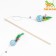 A teaser-piece with a wicker ball and colored feathers on a wooden handle, blue