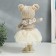Interior doll "Baby in a beige outfit, a skirt from a mesh" 33x15x18.5 cm