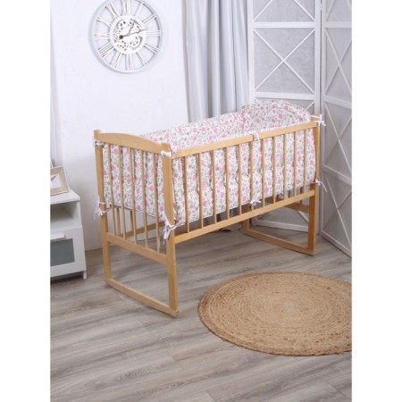 A set of sides in a crib without a canopy (bunny on