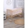 A set of sides in a crib without a canopy (bunny on