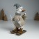 Polystone souvenir "Goose skiing, with a goose on the back" gray-beige 9.5x13.5x23.5 cm